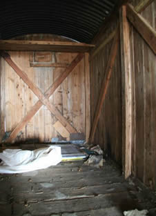 Inside of traditional shepherd hut awaiting restoration
